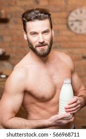 Portrait Naked Muscular Man Holding Bottle Stock Photo 566968711