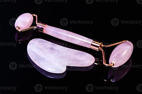 Rose Quartz Facial Roller And Massage Stone Gua Sha Isolated On White