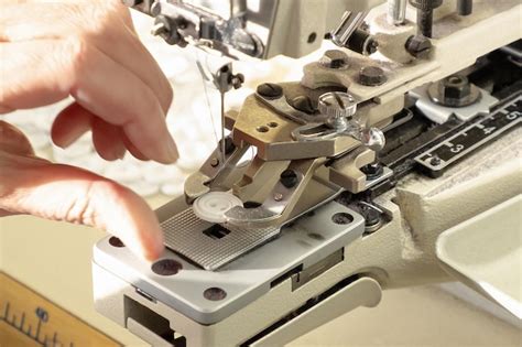 Premium Photo | Textile industry. loops and buttons. industrial sewing equipment.