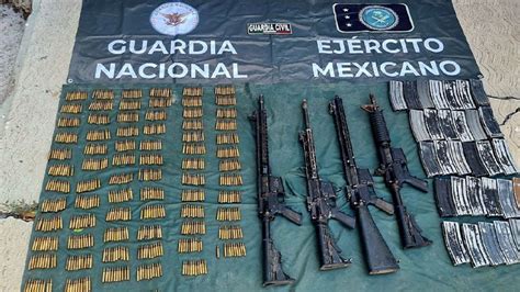 En Tepalcatepec Ssp Sedena Y Gn Aseguran Armas De Fuego Y Municiones