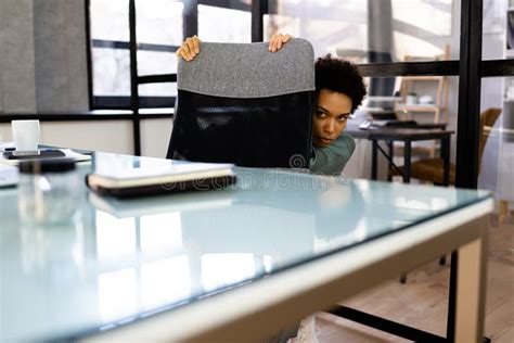 Hiding Under Desk Office Worker