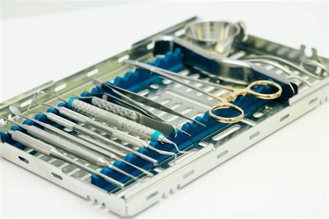 Premium Photo | Dental implantation surgical set. surgical kit of ...