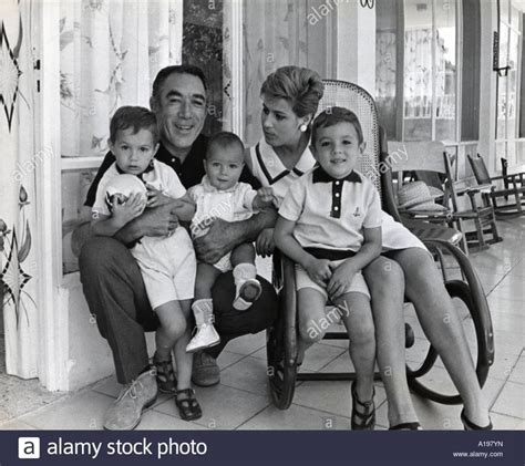 an old black and white photo of a family posing for the camera with ...