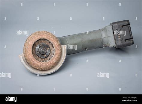 Battery Operated Angle Grinder With Grinding Abrasive Disc Mounted