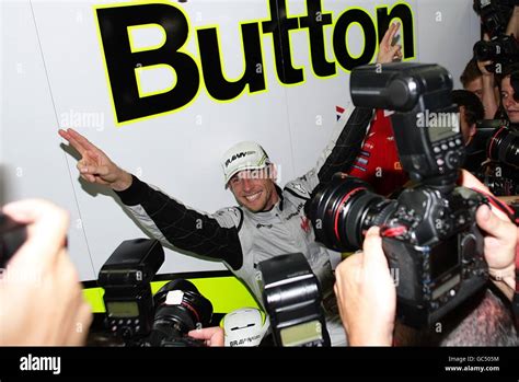 Brawn Gp S Jenson Button Centre Celebrates After Winning The World