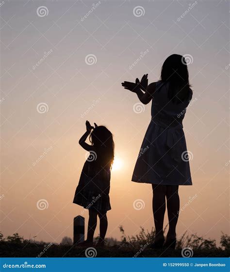 Mother And Child Praying Silhouette