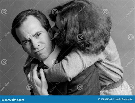 Angry Man Being Hugged From Behind By Woman Stock Image Image Of Bonding Lifestyle 168554563