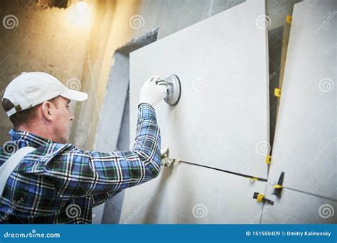 Installing A Large Ceramic Tile Stock Photography | CartoonDealer.com ...