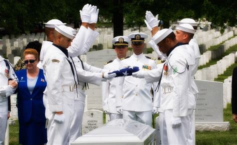 Navy flag ceremony above casket at Arlington National Cemetery ...