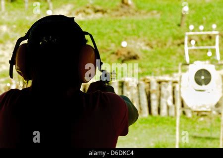 Asian young woman shooting with a Taurus 357 Magnum Revolver on a ...