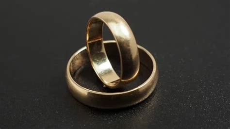 Wedding rings on a black background. Gol... | Stock Video | Pond5