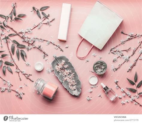 Cosmetic Concept Various Facial Products And Paper Shopping Bag On Pastel Pink Background With