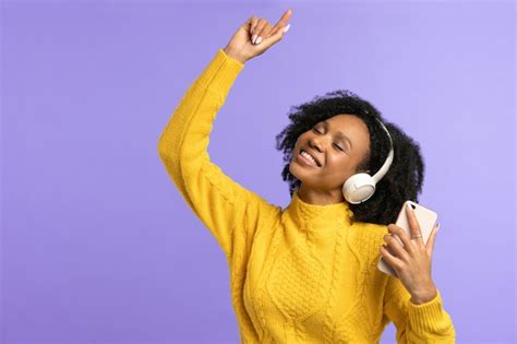 Premium Photo Energized Mixed Race Woman Dancing Wears Wireless