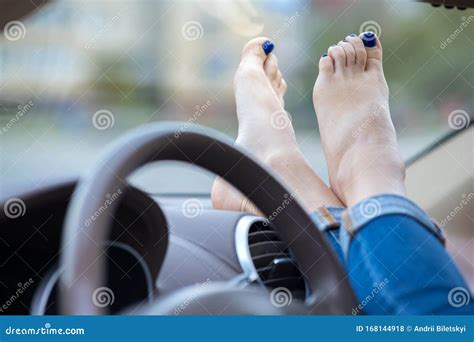 Close Up of Woman Driver Feet Resting on Car Dashboard Stock Photo ...