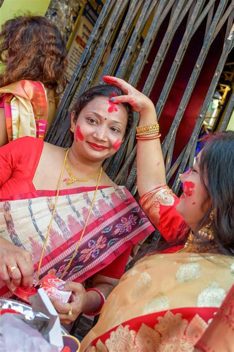 Women Participate In Sindur Khela At A Puja Pandal On The Last Day Of