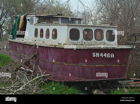 Old Abandoned Wrecked Boat At River Shore Stock Photo Alamy