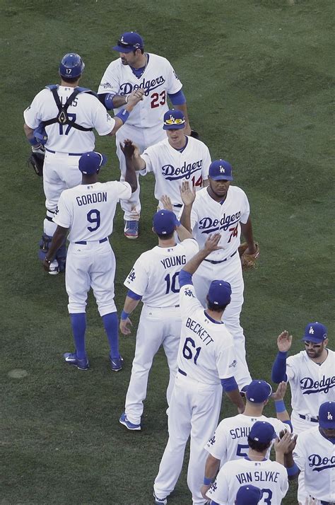 Los Angeles Dodgers slap hands after of Game 5 of the National League ...