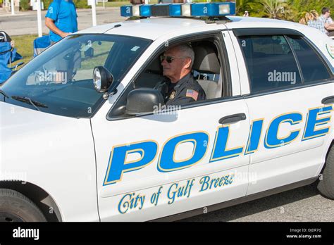 Police Officer Driving Car City Of Gulf Breeze Florida USA Stock Photo