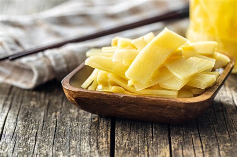 Premium Photo Sliced Canned Bamboo Shoots In Wooden Bowl