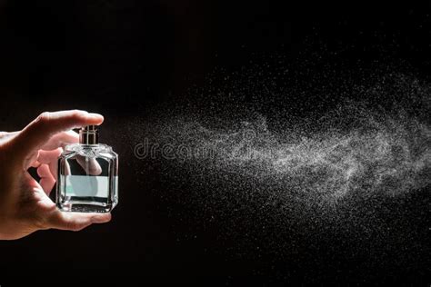 Spraying Perfume on Dark Background, Closeup Stock Image - Image of ...