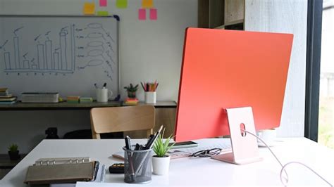 Premium Photo | Computer plant and office supplies on white office desk