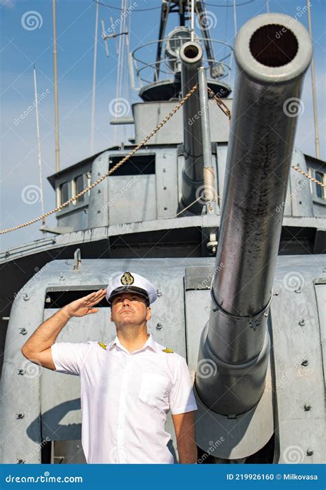 A Navy Officer Standing Under a Ship`s Cannon and Do Salute Stock Photo ...