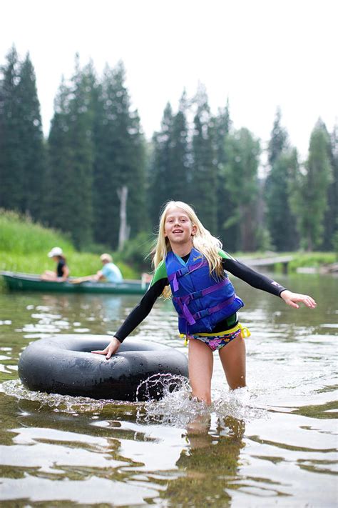 Portrait Of Girl With Inner Tube Photograph By Woods Wheatcroft Pixels