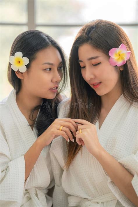 Lgbtq Lesbian Couple Having Romantic Moment Relaxing Together In Spa