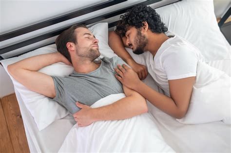 Premium Photo Good Sleep Two Young Men In Bed Sleeping And Looking