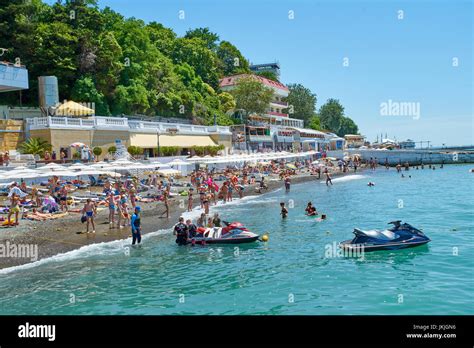 Sochi Russia 06 July 2017people Swim And Sunbathe At The City