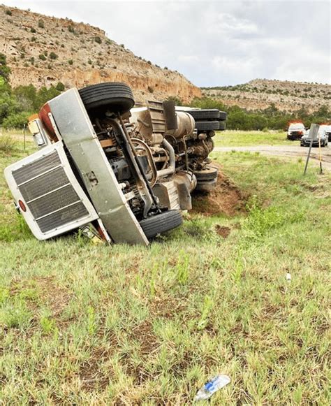 scene  overturned dump truck  bottom  truck route