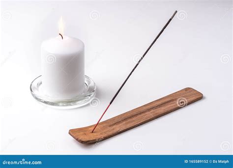 Candle And Incense Stick On A Wooden Plate With White Background Stock