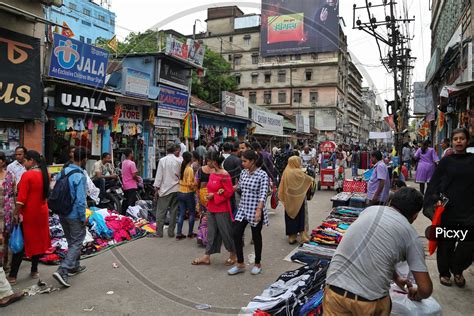 Image Of A Busy Street With Stalls And Shoppers At Fancy Bazaar In