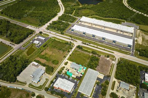 Premium Photo Aerial View Of Industrial Park With Goods Warehouses