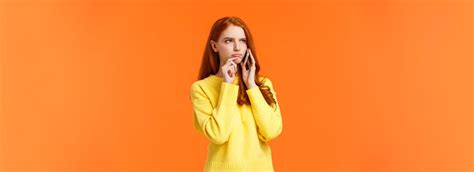 Free Photo Indecisive And Unsure Skeptical Seriouslooking Redhead Woman Having Tough Decision