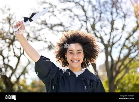 My journey to success begins here. Portrait of a young woman cheering on graduation day Stock ...