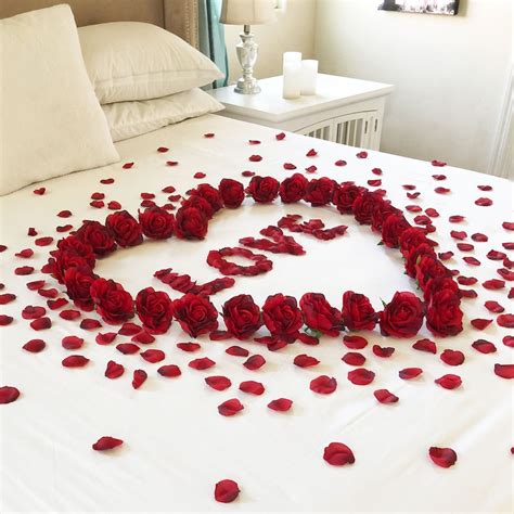 Red Rose Petals On Bed