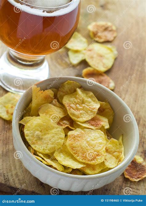 Beer and chips stock photo. Image of yellow, bubble, vertical - 15198460