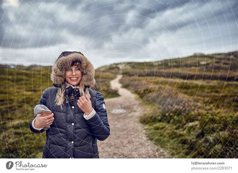 Middle Aged Woman Braving A Cold Winter In Nature A Royalty Free