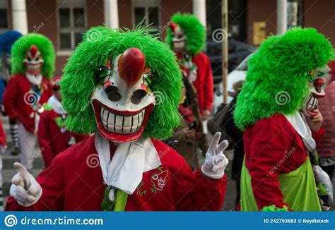 Portrait Of Colorful Masked People Parading In The Street Editorial