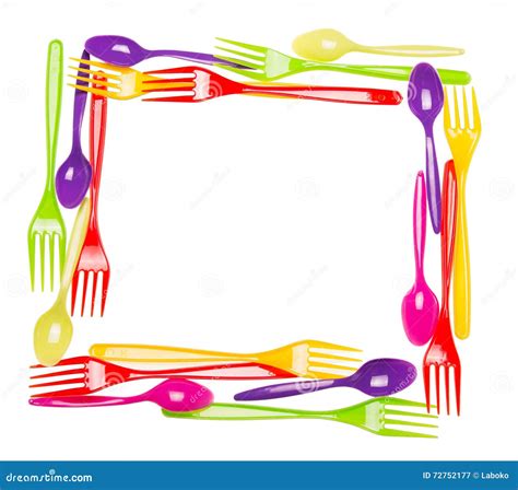 Plastic Multi Colored Spoons And Forks Laid Out In The Shape Of The