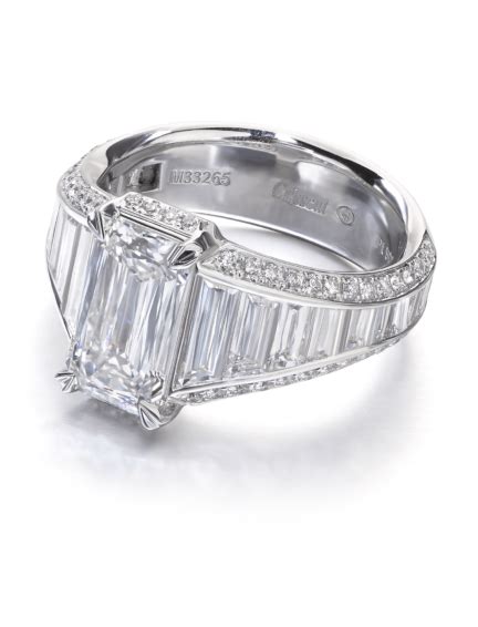 Unique Emerald Cut Diamond White Gold Engagement Ring With Tapered Baguette And Round Diamond