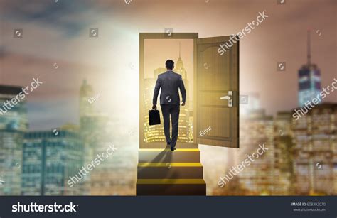 Businessman Walking Towards Open Door Stock Photo Shutterstock