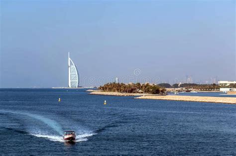 Waterfront View Of Burj Al Arab Under Cloudy Sky Seven Star Hotel A