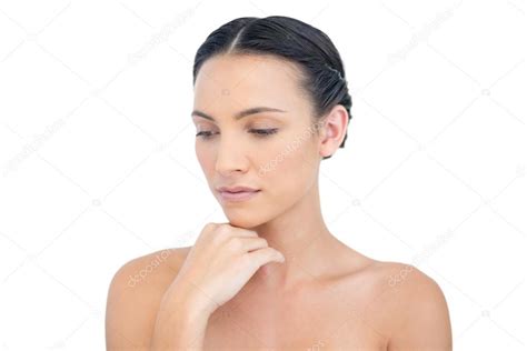 Thoughtful Nude Model Posing Hand On Her Chin Stock Photo