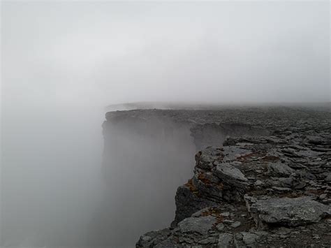 Dark Cliff Covered With Fog · Free Stock Photo