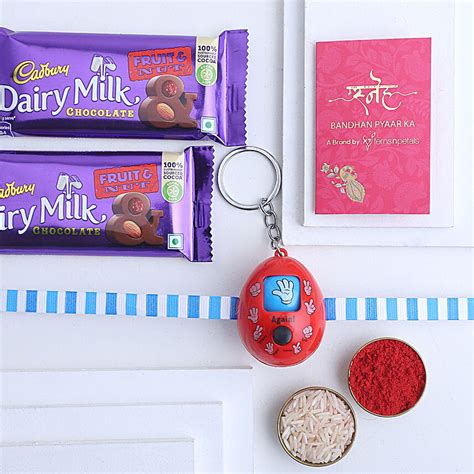 Buy Send Sneh Games Push Button Rakhi Fruit N Nut Bars Online Fnp