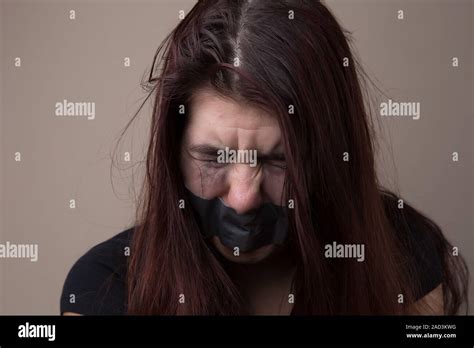 Brunette Hostage With Gray Tape Stock Photo Alamy
