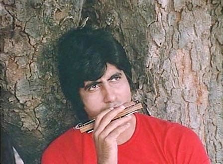 Which musical instrument is played by Amitabh Bachchan in the film Sholay?