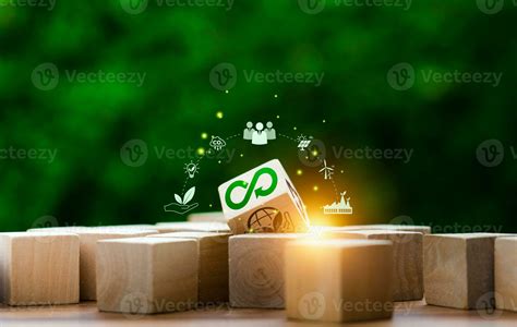 circular economy icons in wooden cubes. economic system that aims to